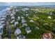Aerial view of an island community nestled amidst lush greenery and the ocean at 26 Beachwood East, Isle of Palms, SC 29451