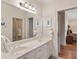 Bathroom featuring a double vanity, a large mirror, and decorative accents at 26 Beachwood East, Isle of Palms, SC 29451