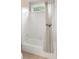 Bright bathroom featuring a white tub with shower and a window for natural light at 26 Beachwood East, Isle of Palms, SC 29451