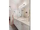 Bathroom featuring a double vanity, a large mirror, and decorative accents at 26 Beachwood East, Isle of Palms, SC 29451