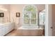 Bright and spacious bathroom with a soaking tub and separate shower at 26 Beachwood East, Isle of Palms, SC 29451