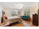 Spacious bedroom with hardwood floors, a futon, and large windows for natural light at 26 Beachwood East, Isle of Palms, SC 29451