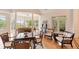 Sun-drenched dining room with high ceilings, stylish decor and views at 26 Beachwood East, Isle of Palms, SC 29451