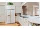 Kitchen with white cabinets, a built in pantry, hardwood floors and white countertops at 26 Beachwood East, Isle of Palms, SC 29451