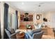 Comfortable living room with built-in shelves, lots of seating, and hardwood floors at 26 Beachwood East, Isle of Palms, SC 29451