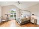 Comfortable bedroom with a four-poster bed and a telescope by the window at 26 Beachwood East, Isle of Palms, SC 29451