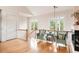 Bright upstairs sitting area with hardwood floors, windows, and fireplace at 26 Beachwood East, Isle of Palms, SC 29451