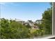 View of the neighborhood featuring well-maintained homes and lush landscaping at 26 Beachwood East, Isle of Palms, SC 29451
