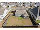 Aerial view of the home with a fenced backyard, and a patio with a screened porch at 261 Celestial Blvd, Summerville, SC 29486