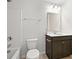 Clean bathroom with white tub/shower, dark vanity, and a well-lit mirror at 261 Celestial Blvd, Summerville, SC 29486