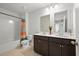 Bathroom featuring double sinks, dark cabinets, shower/tub with curtain and tile flooring at 261 Celestial Blvd, Summerville, SC 29486