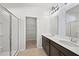 Bathroom featuring double sinks, modern lighting, walk-in shower, and neutral tile at 261 Celestial Blvd, Summerville, SC 29486