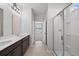 Bright bathroom featuring double sinks, shower, tiled floors, and neutral colors at 261 Celestial Blvd, Summerville, SC 29486
