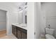 Bathroom featuring double sinks, modern lighting, toilet and neutral tile at 261 Celestial Blvd, Summerville, SC 29486