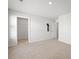 Open bedroom with neutral carpet, large window, and a closet at 261 Celestial Blvd, Summerville, SC 29486