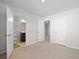 Bright bedroom with neutral carpet, white trim and doors leading to a bathroom and hallway at 261 Celestial Blvd, Summerville, SC 29486