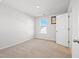 Bright bedroom with neutral carpet, window and ensuite bathroom entrance at 261 Celestial Blvd, Summerville, SC 29486