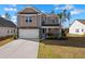 Charming two-story home with a well-maintained lawn and attached two-car garage at 261 Celestial Blvd, Summerville, SC 29486