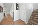 The foyer features hardwood floors, staircase, access to multiple rooms, and great natural light at 261 Celestial Blvd, Summerville, SC 29486