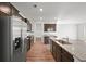 Stainless steel appliances, granite countertops, dark wood cabinetry are kitchen features in this spacious kitchen at 261 Celestial Blvd, Summerville, SC 29486