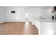 Open concept living area with wood floors and view of the kitchen island at 261 Celestial Blvd, Summerville, SC 29486