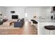 Beautiful, staged living area with a view of the kitchen island with barstool seating at 261 Celestial Blvd, Summerville, SC 29486