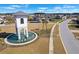 Beautiful community fountain with the word 'Meridian' visible and neighborhood in the background at 261 Celestial Blvd, Summerville, SC 29486