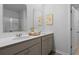 Modern bathroom featuring double sinks with a sleek countertop and a large mirror, offering a clean and functional space at 288 Watersglen Dr, Summerville, SC 29486