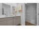 Elegant bathroom featuring dual sinks, sleek fixtures, and a separate shower and tub at 288 Watersglen Dr, Summerville, SC 29486
