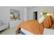Serene bedroom with modern decor, a plush bed, and a round mirror over a white dresser at 288 Watersglen Dr, Summerville, SC 29486