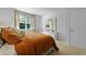Bright bedroom featuring a comfortable bed with throw pillows and a decorative mirror, creating a cozy retreat at 288 Watersglen Dr, Summerville, SC 29486