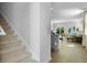 Inviting entryway with stairs and a view into a stylishly decorated living room with lots of natural light at 288 Watersglen Dr, Summerville, SC 29486