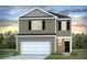 Charming two-story home with a white garage door, black door and shutters, and a well-manicured front yard at 288 Watersglen Dr, Summerville, SC 29486