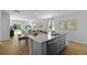 Kitchen island with a sink and dishwasher in an open concept room with views to the backyard at 288 Watersglen Dr, Summerville, SC 29486