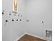 Simple laundry room with wall-mounted hooks and essential connections at 288 Watersglen Dr, Summerville, SC 29486