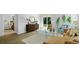 Stylish living room featuring a sleek cabinet, modern decor, an area rug, and a view of the bedroom at 288 Watersglen Dr, Summerville, SC 29486