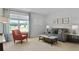 Cozy living room with a bright window, stylish furniture, and neutral decor at 288 Watersglen Dr, Summerville, SC 29486