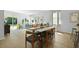 Bright and airy living space with a modern dining table and chairs, and access to a patio through sliding doors at 288 Watersglen Dr, Summerville, SC 29486