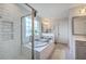Luxurious bathroom featuring a soaking tub, a separate shower, and bright natural light at 300 Saxony Loop, Summerville, SC 29486