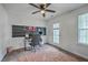 Bedroom with ceiling fan and a dedicated workspace featuring a black pinboard at 300 Saxony Loop, Summerville, SC 29486