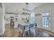 Charming dining area with modern lighting fixtures is adjacent to the kitchen at 300 Saxony Loop, Summerville, SC 29486
