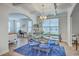 Elegant dining room with coffered ceilings, modern chandelier, and stylish glass table at 300 Saxony Loop, Summerville, SC 29486