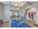 Open-concept dining room with a modern glass table, coffered ceiling, and views to other rooms at 300 Saxony Loop, Summerville, SC 29486