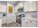 Well-equipped kitchen features stainless steel appliances, subway tile backsplash, and ample cabinet space at 300 Saxony Loop, Summerville, SC 29486
