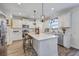 Bright kitchen with a central island, modern appliances, and ample counter space at 300 Saxony Loop, Summerville, SC 29486