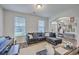 Comfortable living room with modern furnishings, open layout, and view to the foyer at 300 Saxony Loop, Summerville, SC 29486