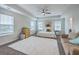 Spacious main bedroom with tray ceilings, large windows, and natural light creates a peaceful retreat at 300 Saxony Loop, Summerville, SC 29486