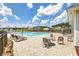 Community swimming pool with comfortable lounge chairs and tables with umbrellas at 300 Saxony Loop, Summerville, SC 29486