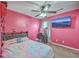 Bright bedroom with pink walls, a ceiling fan and carpeted floors provides a modern and cozy style at 3055 Nantuckett Ave, North Charleston, SC 29420