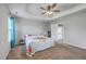 Primary bedroom with tray ceiling, carpet, and ensuite bathroom with glass shower door at 3055 Nantuckett Ave, North Charleston, SC 29420